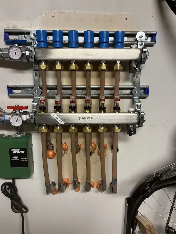 Plumber performing Gas Leak Detection at a residential property in Siloam Springs